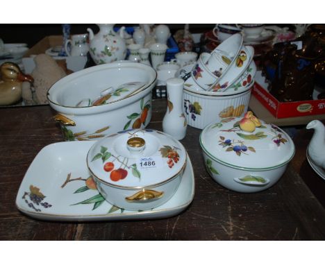 A quantity of Royal Worcester 'Evesham' dinnerware including lidded tureens, cruet items, baking dishes, etc.