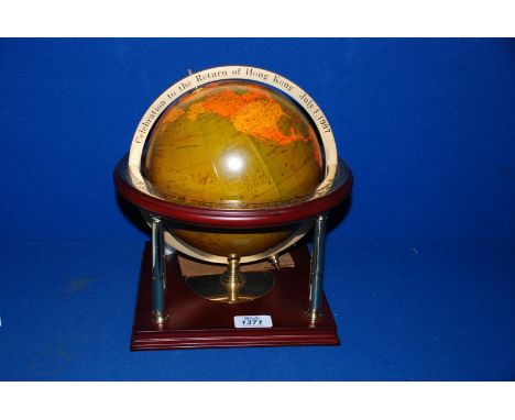 A Globe on wooden stand