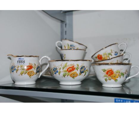 A Royal Albert floral part Teaset comprising six cups and three saucers, six tea plates, cake plate, sugar bowl, milk jug, et