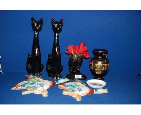 A box of china including a pair of tall black Cat Vases, a Mercedes-Benz dish, ceramic wall ducks, Grecian vase, etc.