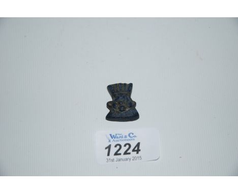 A rare Egyptian carved lapis lazuli amulet representing the god Bes. Ptolemaic or early Roman period. 1" x 3/4"