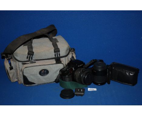 A Camera case and lenses including Canon Zoom 80 - 200 mm lens, Canon DL Zoom 35 - 80 mm lens, Canon EOS 100 camera body, etc