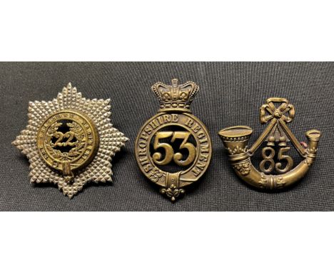 Three Victorian British Cap badges: Shropshire Regiment 53rd of Foot: Cheshire Regiment 22nd of Foot: 85th Kings Regiment of 