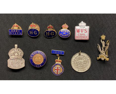 WW2 British Enamel Lapel Badge collection to include: ARP badge in hallmarked silver: Four Home Guards enamel lapel badges: W