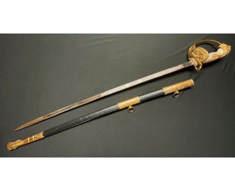 Kreigsmarine Officers Lion Head Sword with pipe backed blade 810mm in length with etched decoration of sailing ships, foliage