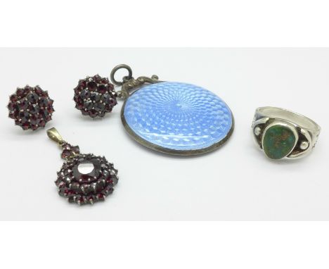 A silver and enamelled handbag mirror, a white metal Bohemian garnet pendant and earrings and an Arts and Crafts ring
