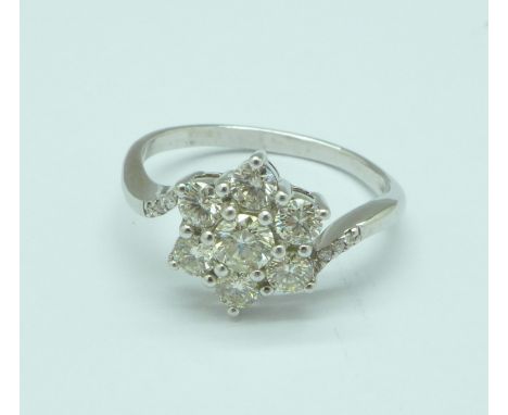 An 18ct gold and diamond cluster ring, approximately 1.20 carat diamond weight, 4.4g, R