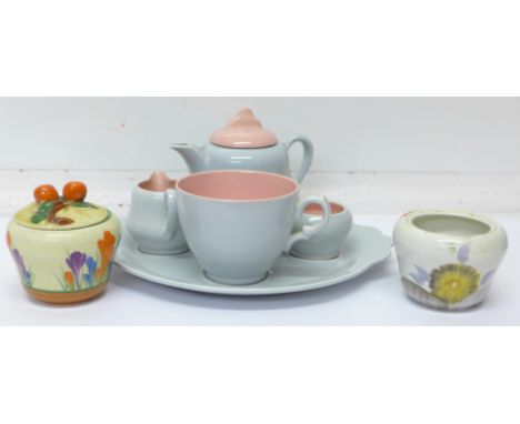 A Royal Staffordshire Ceramics Clarice Cliff tea for one teaset, a Clarice Cliff Bizarre Crocus pattern preserve pot and one 