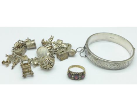 A silver charm bracelet, bangle and ring, 90g