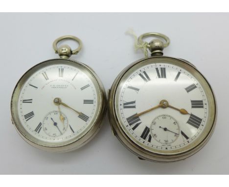 Two silver pocket watches, one lacking button