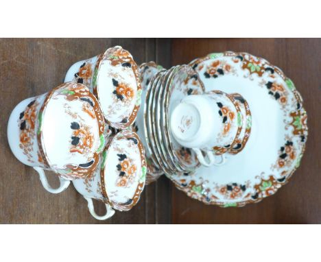A Royal Albert tea service, five cups, six saucers and side plates and a cake plate