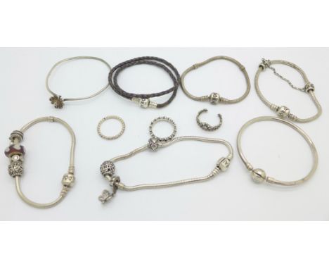 Six Pandora bracelets, charms, three rings and a silver Tiffany bangle