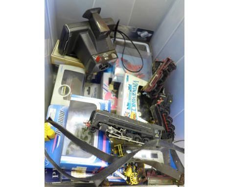Model rail, die-cast model vehicles and a Polaroid camera