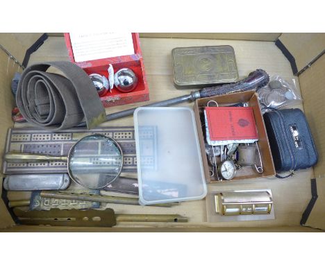 A 1914 WWI Christmas tin, military badges, buttons, belt, compass, coins, opera glasses, two harmonicas, penny whistle, etc.