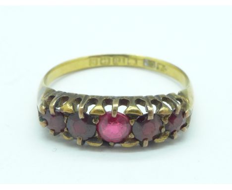 An 18ct gold five stone garnet ring, 3.2g, Q, one stone replaced, Birmingham 1909