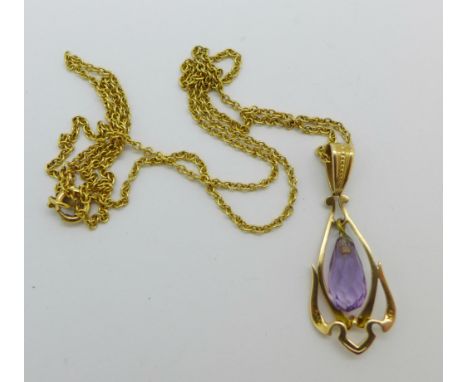A 14ct gold and amethyst pendant with a 9ct gold chain, 3.6g