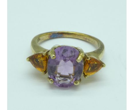 A silver gilt, amethyst and citrine trilogy ring, O