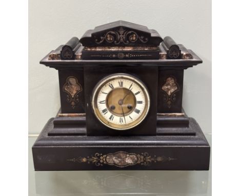 A Victorian architectural slate mantle clock with marble inserts, with a circular dial with Roman numerals and an eight day m