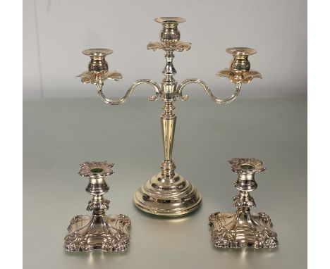 A modern epns three branch candelabrum of tapered cylinder firm on stepped circular base: h. x 35cm l. x 34cm and a pair of s