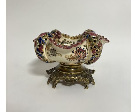A Hungarian J Fischer of Budapest reticulated bowl of pierced form with chrysanthemum design mounted on a bronze metal rococo
