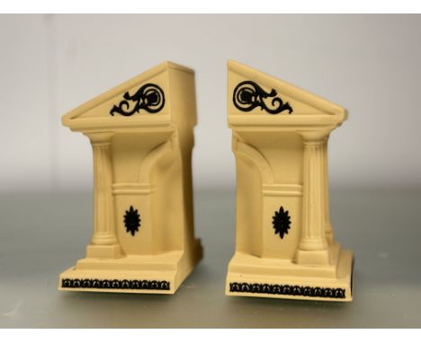 A Wedgewood yellow jasperware Library Collection artched bookends, with black cane basalt decoration, marked verso. (h-19cm) 