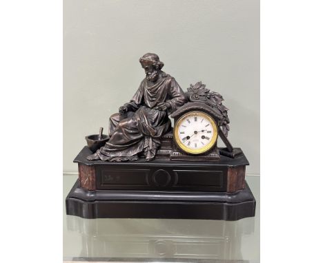 A Victorian black slate mantle clock, with a white enamel dial with an eight day movement, the dial marked 'John Mason Rother