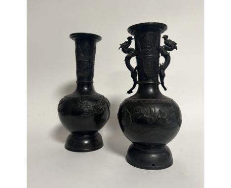 A pair of Chinese bronze vases decorated with birds and floral motifs to body and a pair of dragons to the neck (a/f one drag
