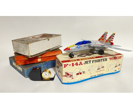 A vintage Son AI Toys made battery operated F-14 A Tomcat Jet Fighter, together with a collection of vintage jigsaw puzzles o
