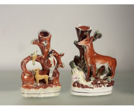 A 19thc Stafforshire flatback spill vase in the form of a tree trunk with a young boy, fawn and bird together with a Stafford