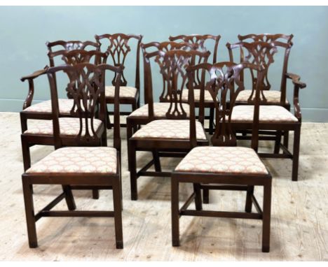 A set of Chippendale style mahogany dining chairs, comprising eight single and two carvers, with drop in seats, standing on p