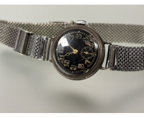 A vintage Dolland of Park Lane London silver black dial wristwatch with phosphorus - some areas of loss to arabic numerals an