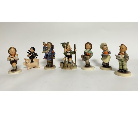 A collection of West German M.J. Hummel Goebel Pottery figurines comprising, 'Happy Traveller' (h. 13cm), 'Baker' (h. 12cm), 