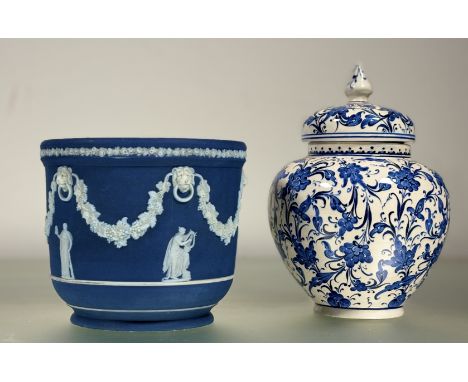 A 19thc Wedgewood Jasperware cobalt blue cameoware jardinière, with classical scenes with grape vines and lion mask loops (ma