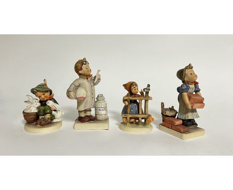 A collection of West German M.J. Hummel Goebel Pottery figurines comprising, 'Little Pharmacist' (h. 15cm), 'Playmates' (h. 9