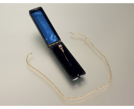 A 9ct gold rope pattern necklace a/f 3g and ne Edwardian yellow metal stick pin set faceted paste ston in original box: l. x 
