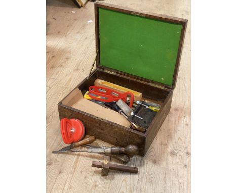 A handmade tool box containing a collection of screw drivers, chisels, a scribe etc (a lot) 