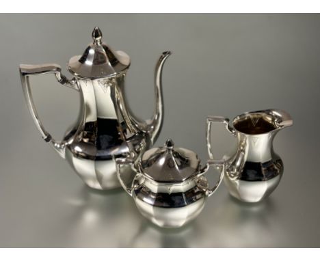 An elegant Community Plate three piece coffee service of tapered panel design: coffee pot h. x 27cm 