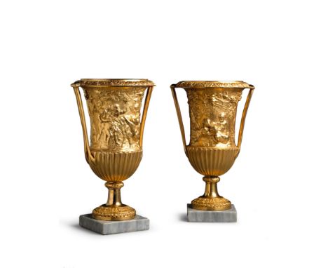 A Pair of Empire Gilt Bronze Vases Italy circa 1810, decorated in the round with Bacchic scenes depicting putti  c avorting a