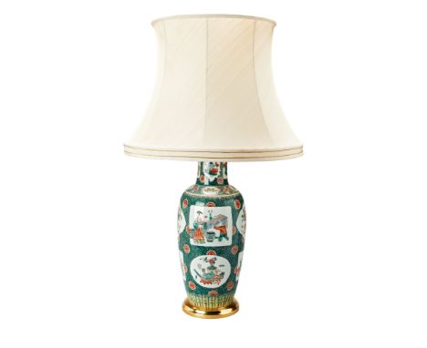 A Famille Verte Vase Mounted as a Lamp China circa 1700, of rouleau form decorated with panels depicting domestic scenes alte