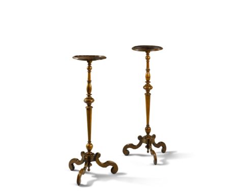A Pair of William and Mary Torcheres England circa 1700, having turned tops and waisted tapering stems supported by a tripod 