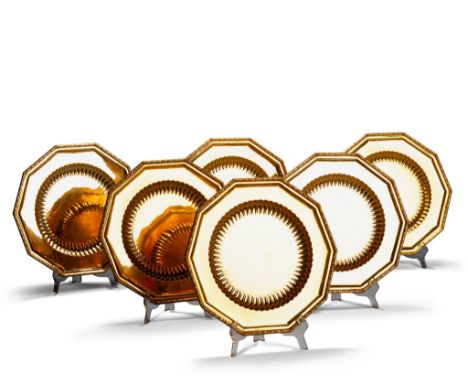 Twelve Silver Gilt Under Plates Austria circa 2001, of decagonal form in the Empire style with a boldly gadrooned central rec