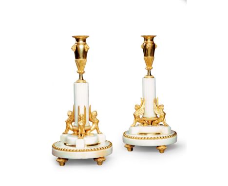 A Pair of Empire Period Swedish Marble Candlesticks Sweden circa 1790, each takes the form of an attenuated gilt bronze vase,