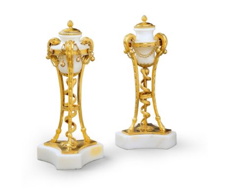 A Pair of White Marble and Gilt Bronze Cassolettes France circa 1785, in the form of atheniennes, the tripod gilt bronze supp
