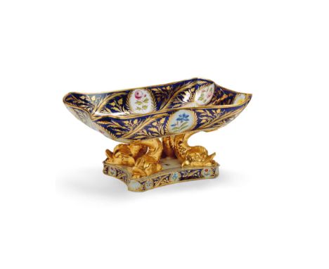 A Worcester Dolphin Tazza England circa 1820, decorated with a blue ground with gilded highlights and oval panels of flowers,
