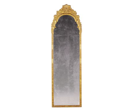 An Unusual Early 18th Century German Pier Mirror Germany circa 1720, with elaborate carved and gilt gesso strapwork to the si