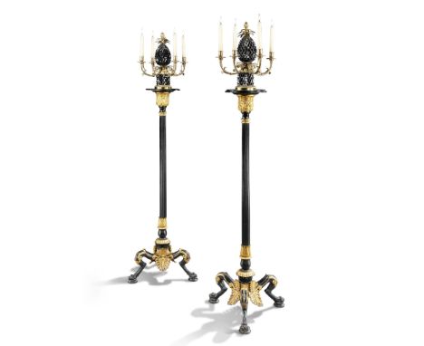 A Pair of Cast Iron Torcheres Germany circa 1820, in the style of Karl Friedrich Schinkel, each has a dished capital enriched