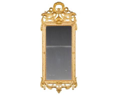 A Mid 18th Century Swedish Parcel Gilt Pier Mirror Sweden circa 1760,  the pierced strapwork cresting embellished with a carv