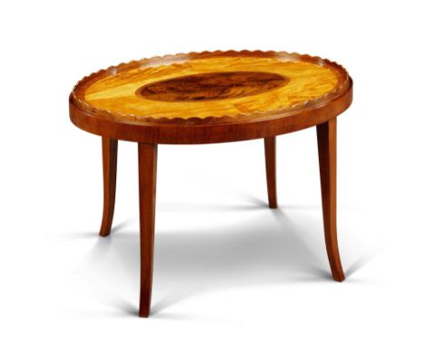 A Satinwood and Mahogany Tray Table England circa 1790, veneered in satinwood with central mahogany oval panel, kingwood cros