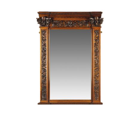 A Pair of Carved Walnut Mirrors Italy circa 1859, attributed to Angelo Barbetti, the top frieze is decorated with an open win