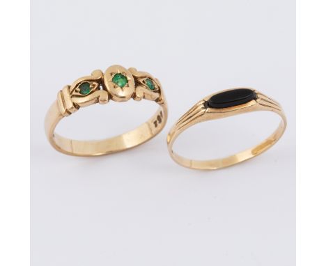 A 9ct yellow gold scroll design ring set with three round cut emeralds, 2.90gm, size Q 1/2 and a 9ct yellow gold ring set wit